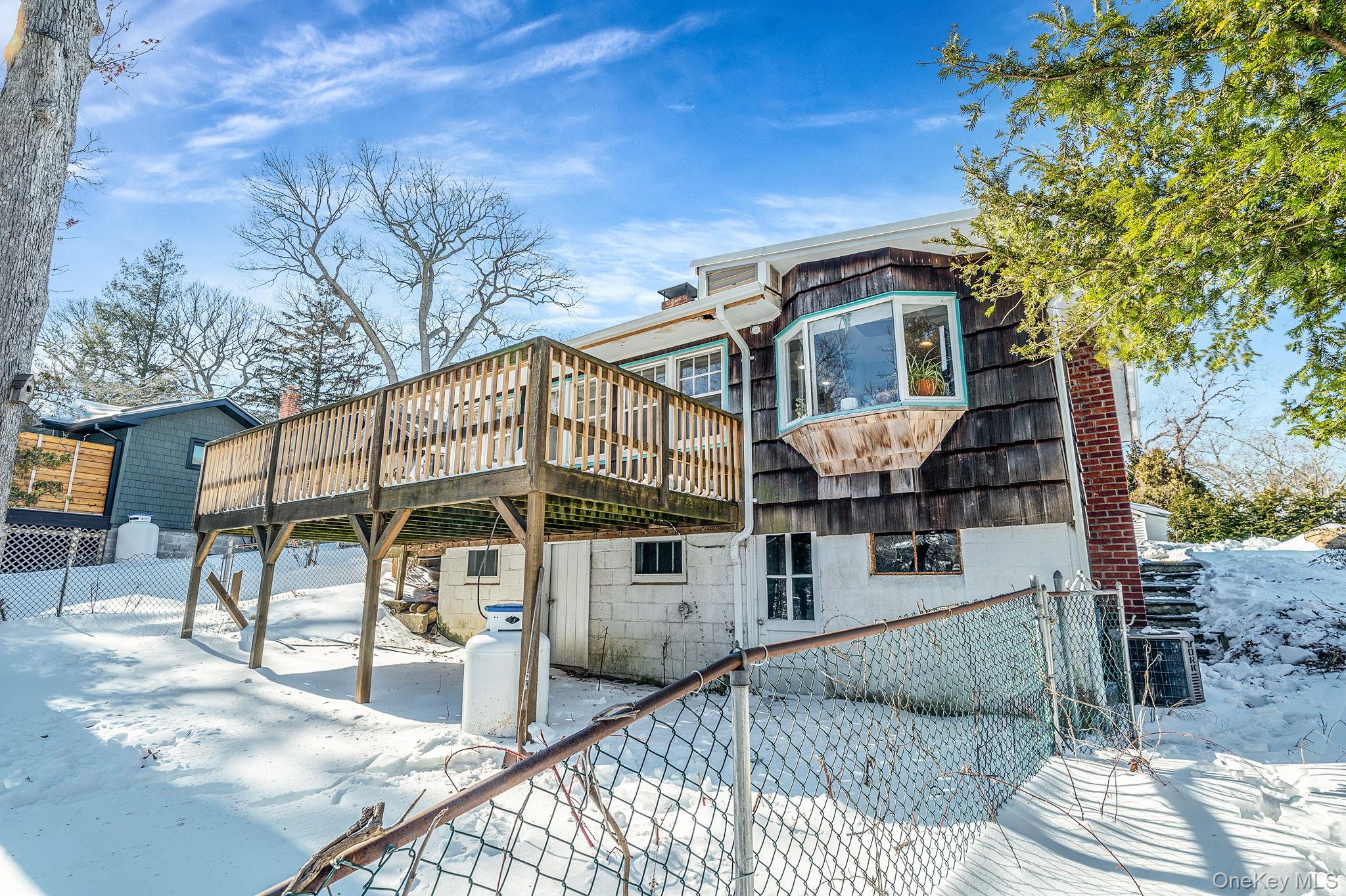 15 Ridge Lane Miller Place, NY 11764 - Photo 18 of 26 a view of a house with a yard