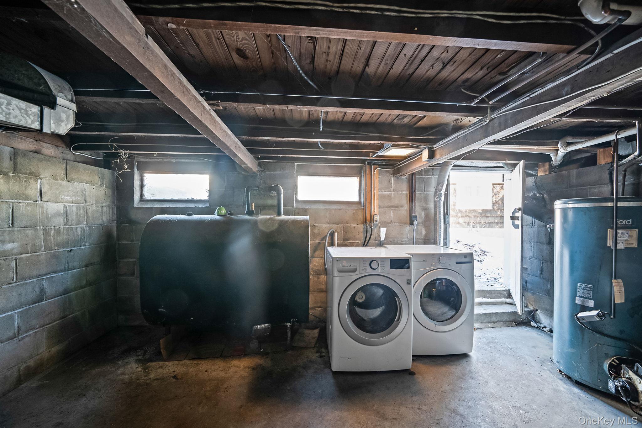 15 Ridge Lane Miller Place, NY 11764 - Photo 20 of 26 a utility room with dryer and washer
