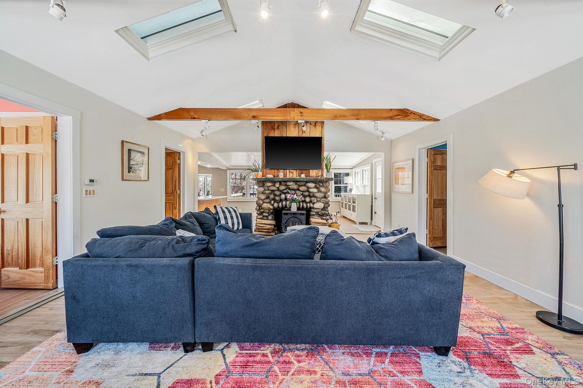 15 Ridge Lane Miller Place, NY 11764 - Photo 2 of 26 a living room with furniture and a fireplace