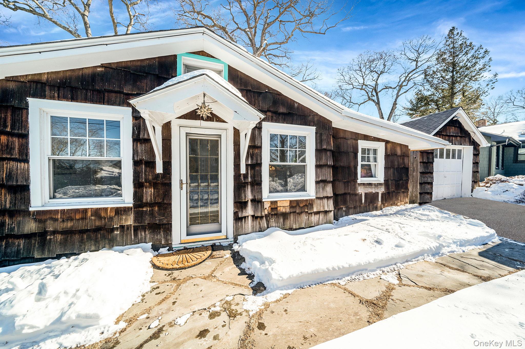 15 Ridge Lane Miller Place, NY 11764 - Photo 24 of 26 a view of a white house with a sitting area
