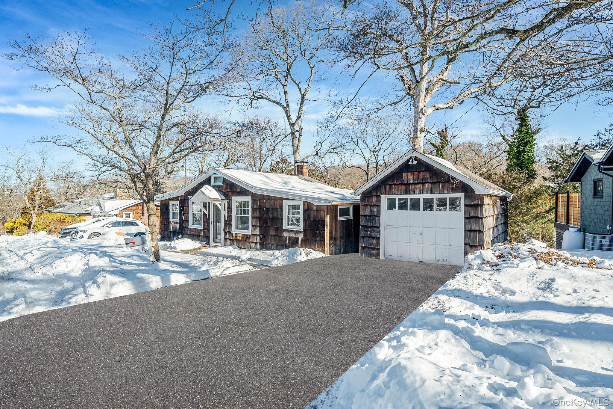 15 Ridge Lane Miller Place, NY 11764 - Photo 25 of 26 a front view of a house with a yard