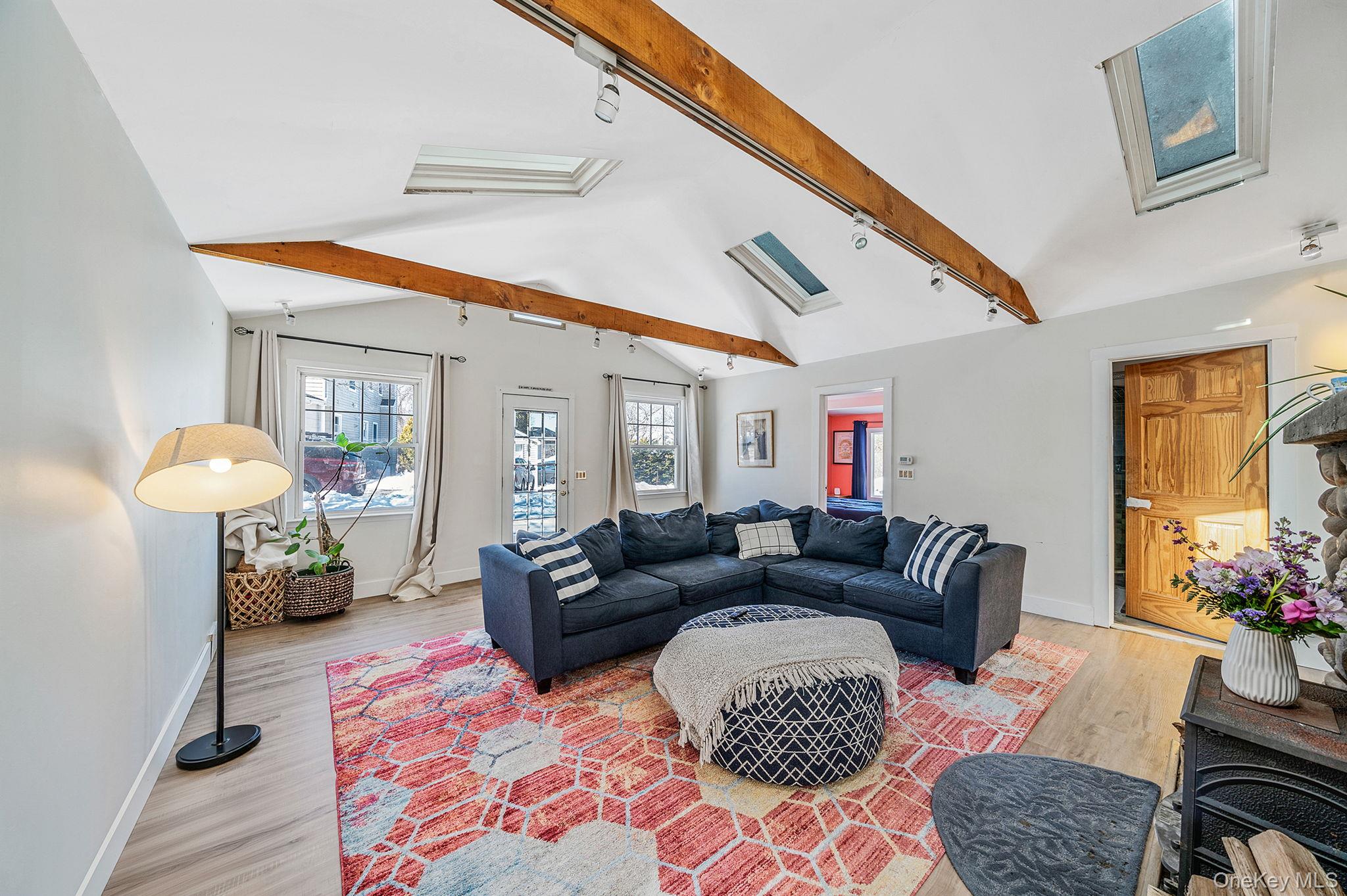 15 Ridge Lane Miller Place, NY 11764 - Photo 3 of 26 a living room with furniture and a potted plant