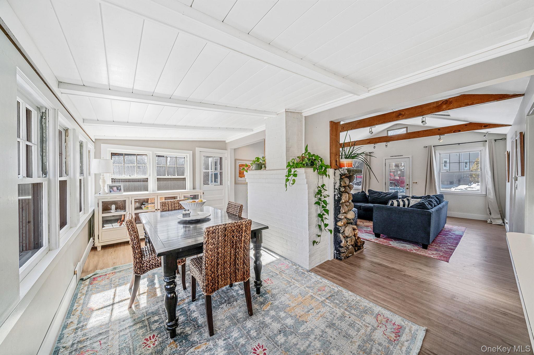 15 Ridge Lane Miller Place, NY 11764 - Photo 6 of 26 a view of a dining room with furniture window and wooden floor