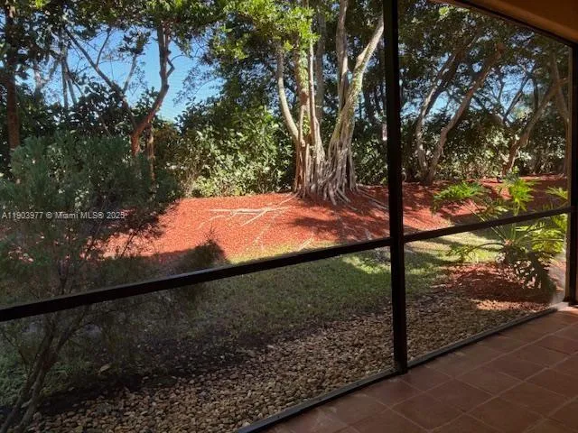 a view of a yard from a balcony