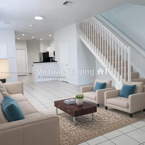a living room with furniture and a couch