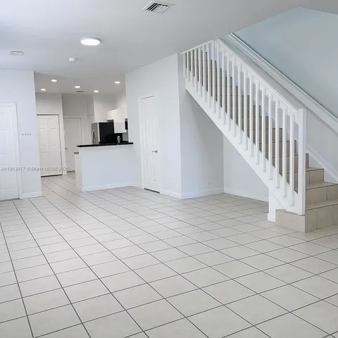 a view of kitchen with furniture and window