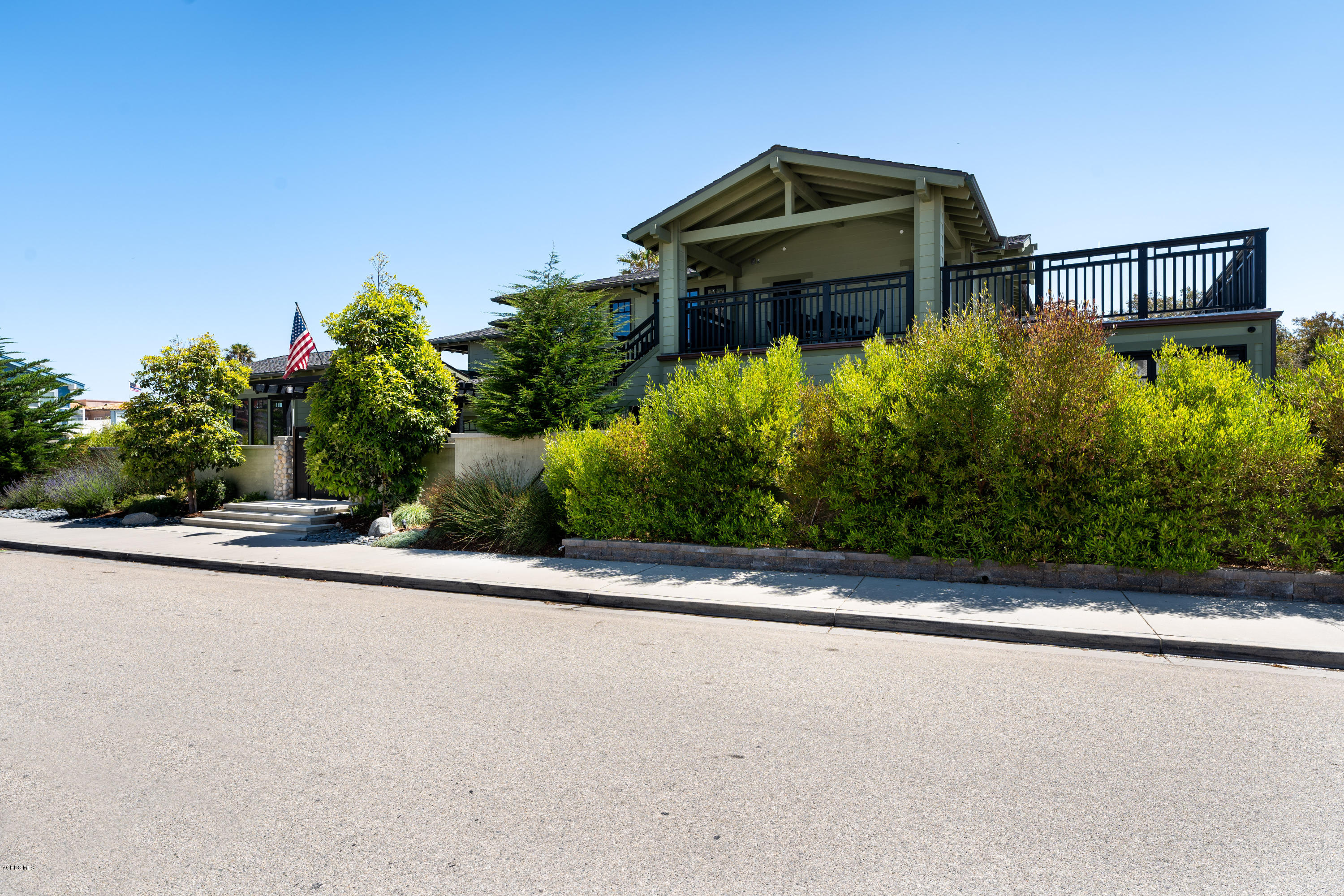 1520 Mandalay Beach Road Oxnard, CA 93035 - Photo 2 of 43 front view of a house with a yard