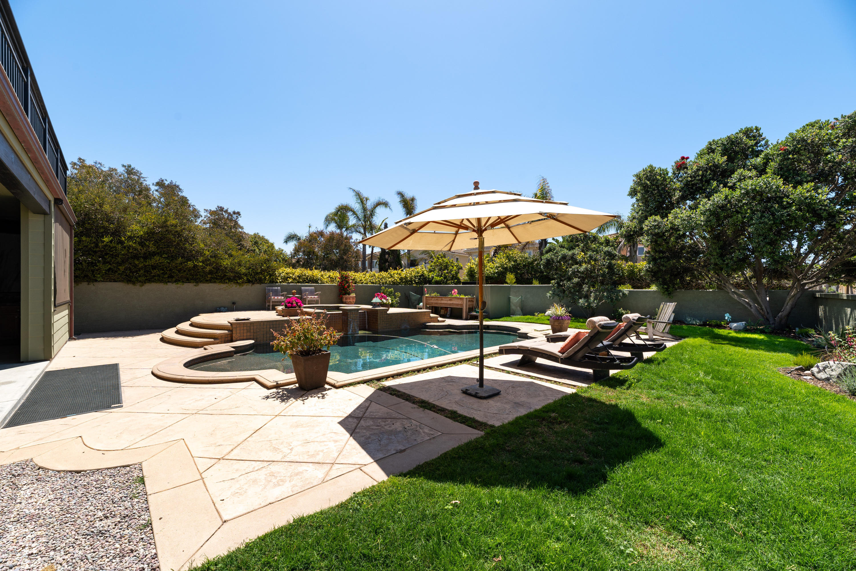 1520 Mandalay Beach Road Oxnard, CA 93035 - Photo 14 of 43 a view of a backyard with sitting area and slide