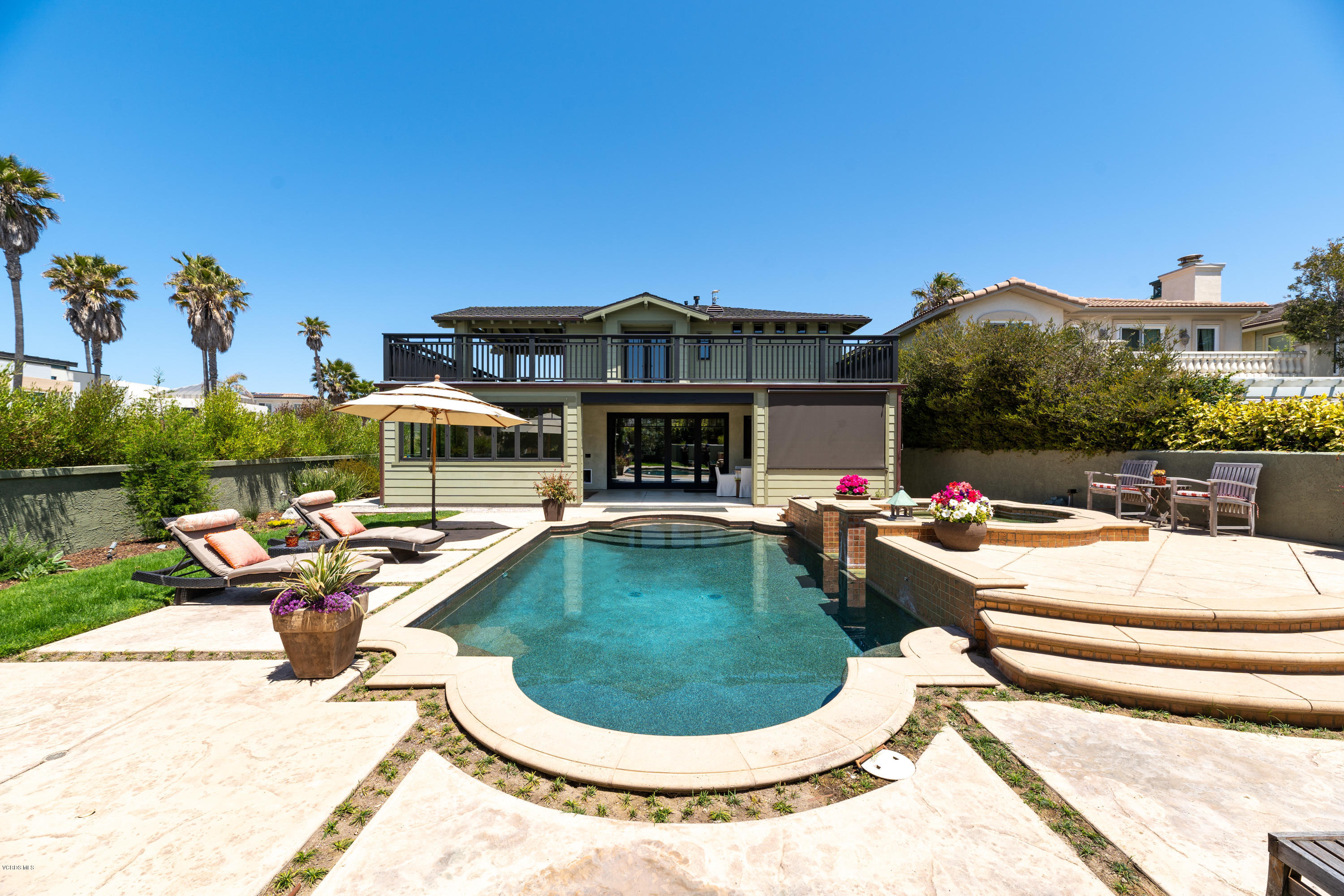 1520 Mandalay Beach Road Oxnard, CA 93035 - Photo 15 of 43 a view of a swimming pool with a lounge chairs