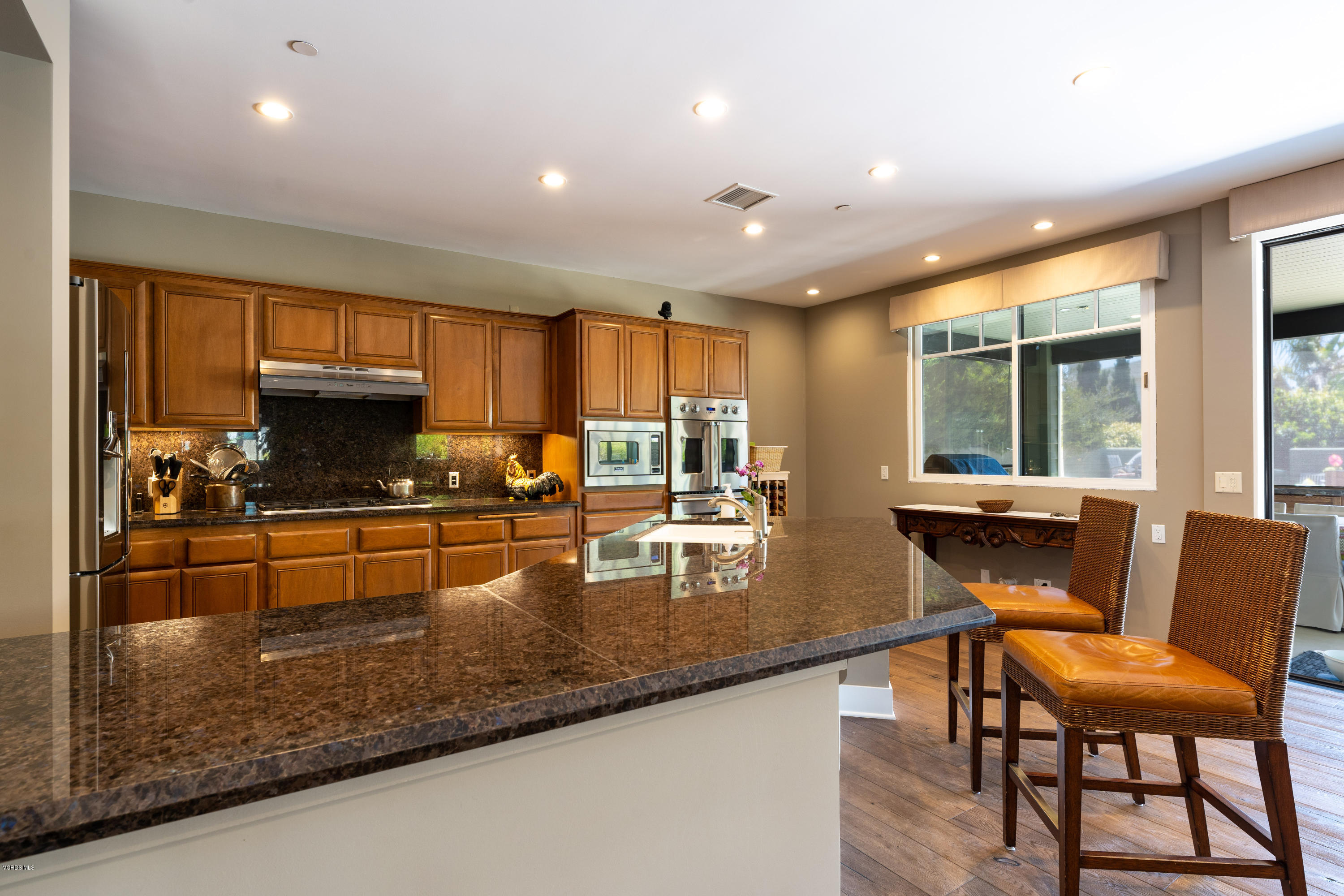 1520 Mandalay Beach Road Oxnard, CA 93035 - Photo 21 of 43 a kitchen with granite countertop lots of counter top space and furniture