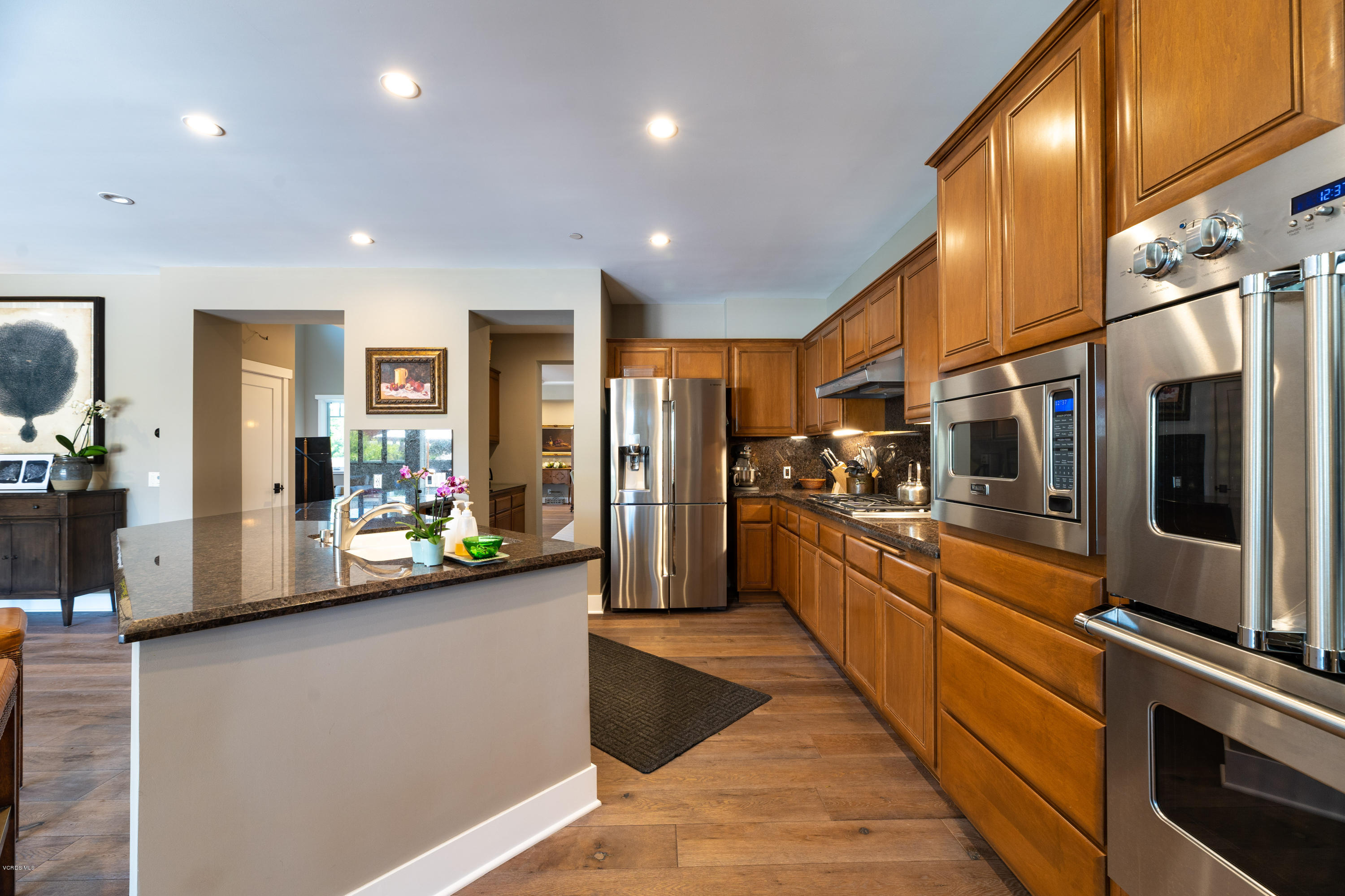 1520 Mandalay Beach Road Oxnard, CA 93035 - Photo 22 of 43 a large kitchen with stainless steel appliances lots of counter space and a refrigerator