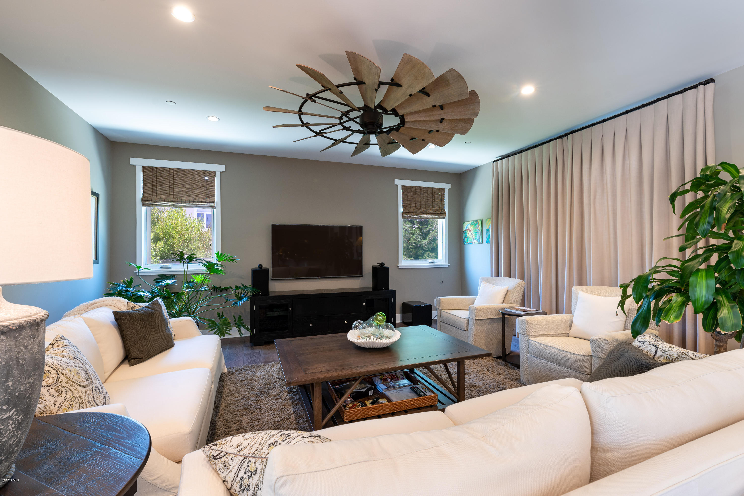 1520 Mandalay Beach Road Oxnard, CA 93035 - Photo 23 of 43 a living room with furniture potted plant a window and a flat screen tv