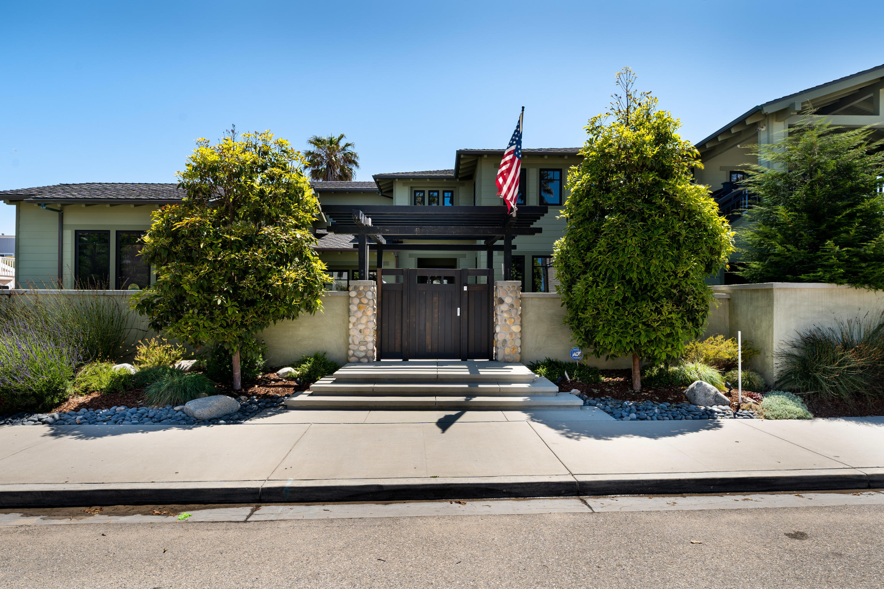 1520 Mandalay Beach Road Oxnard, CA 93035 - Photo 4 of 43 a front view of a house with a yard