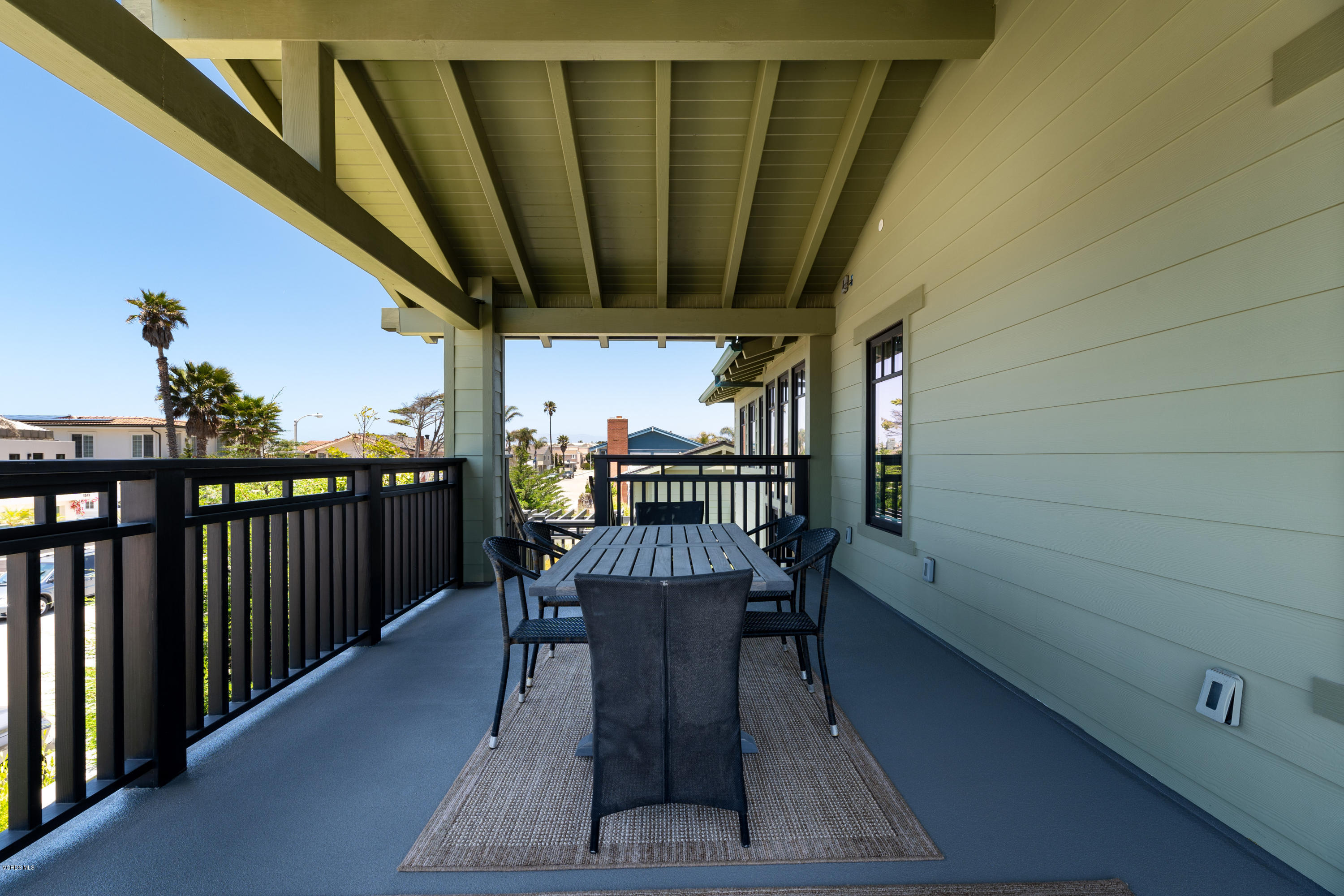 1520 Mandalay Beach Road Oxnard, CA 93035 - Photo 35 of 43 a view of a chairs and table in patio with wooden fence