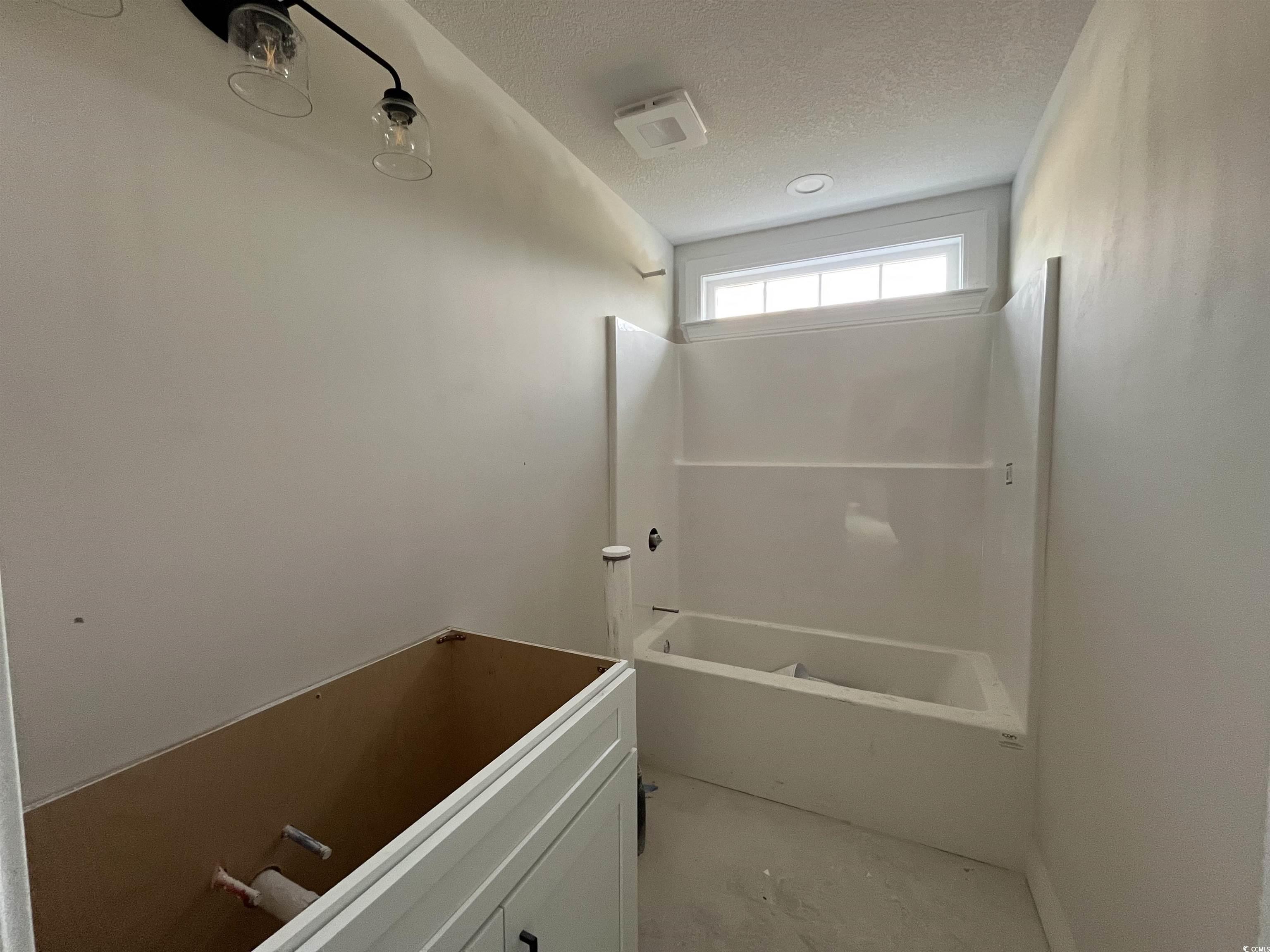 3261 Red Bluff Road Loris, SC 29569 - Photo 12 of 39 Full bathroom featuring a textured ceiling and shower / bath combination