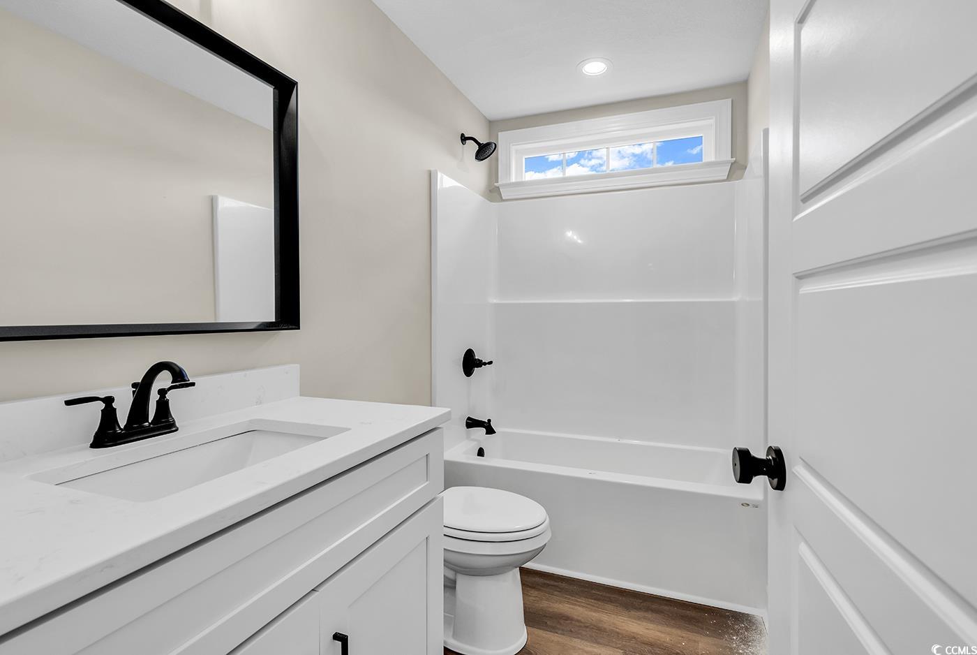 3261 Red Bluff Road Loris, SC 29569 - Photo 23 of 39 Full bathroom featuring shower / washtub combination, vanity, and dark wood-style flooring