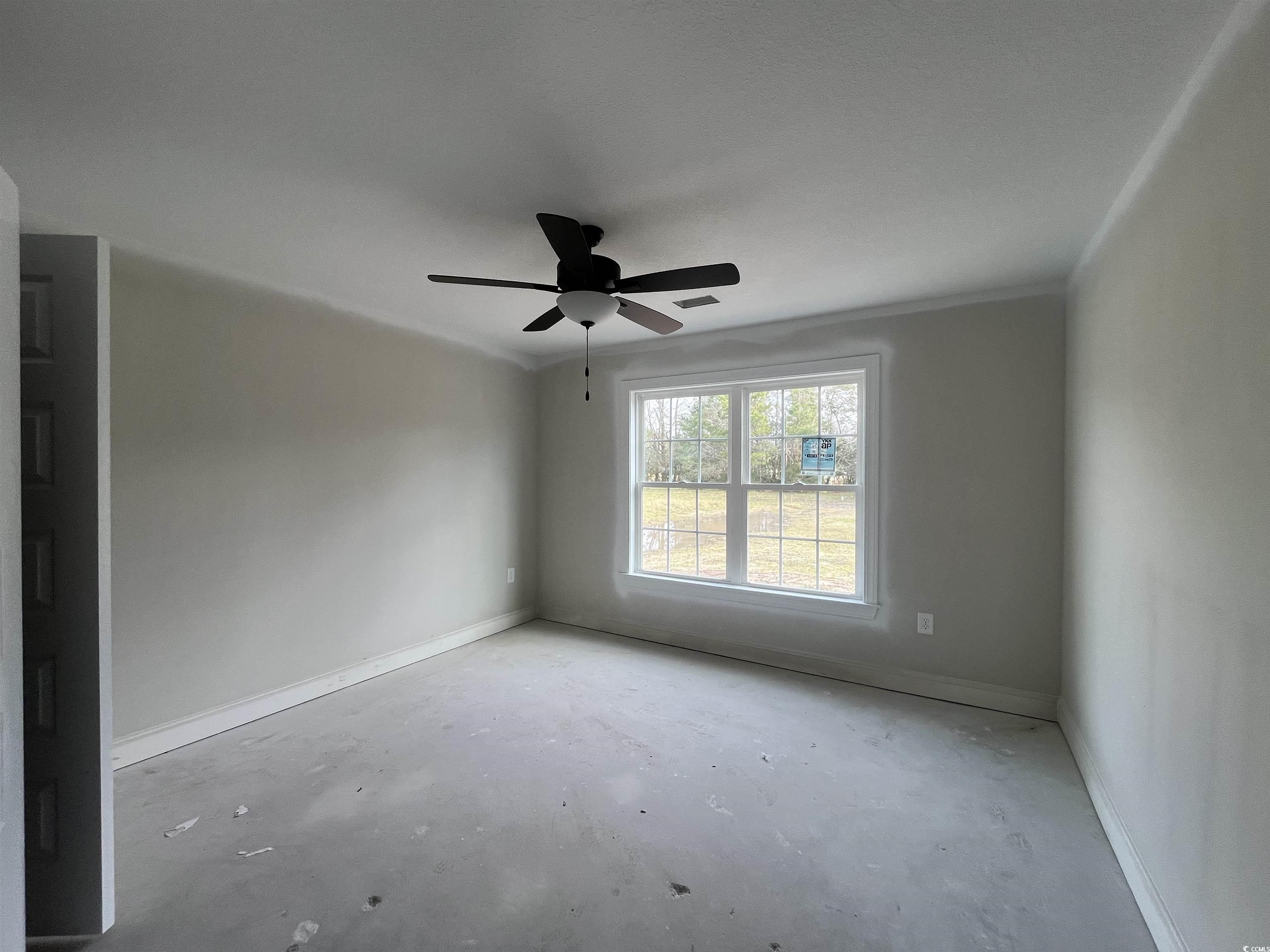 3261 Red Bluff Road Loris, SC 29569 - Photo 6 of 39 Unfurnished room featuring concrete flooring and ceiling fan