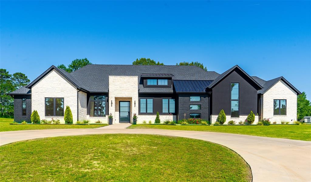2804 Buchanan Road Hallsville, TX 75650 - Photo 1 of 40 a front view of a house with a yard