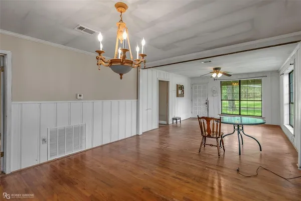a view of a room with furniture window and wooden floor