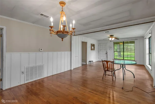 a view of a room with furniture window and wooden floor