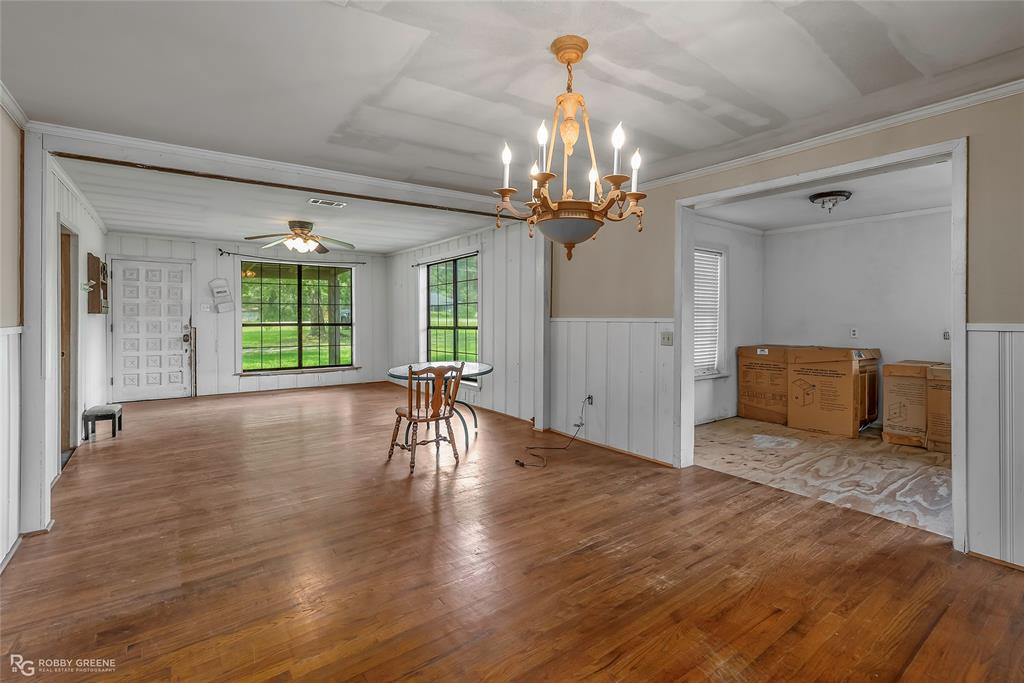 411 Camp Bistno Road Doyline, LA 71023 - Photo 17 of 32 a view of a livingroom with a furniture wooden floor and chandelier