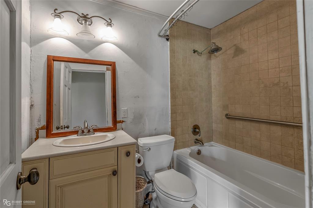 411 Camp Bistno Road Doyline, LA 71023 - Photo 20 of 32 a bathroom with a sink a toilet and shower