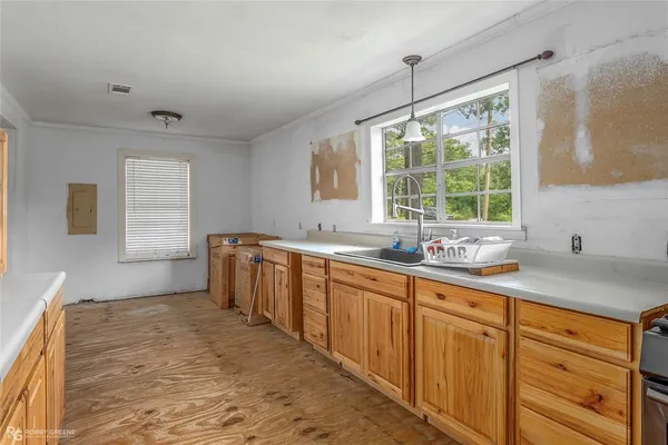 a kitchen with sink refrigerator and window