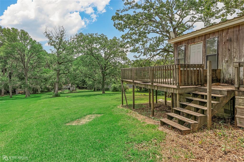 411 Camp Bistno Road Doyline, LA 71023 - Photo 4 of 32 a view of a chair and table in the garden