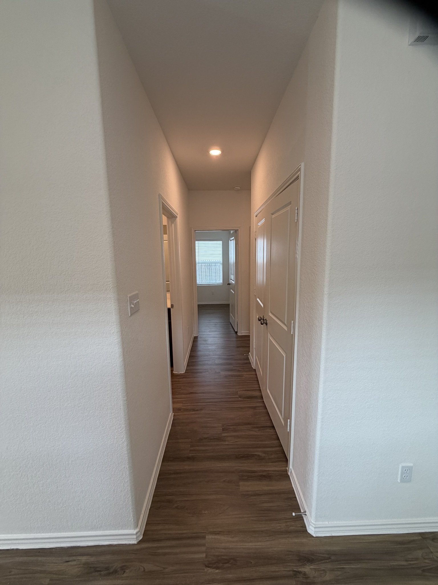 408 Buckners Street Georgetown, TX 78626 - Photo 3 of 15 a view of a hallway with wooden floor