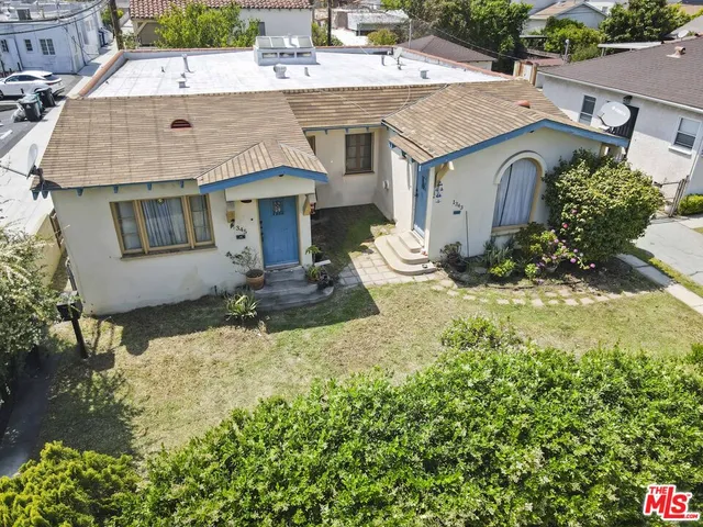 a aerial view of a house with a yard