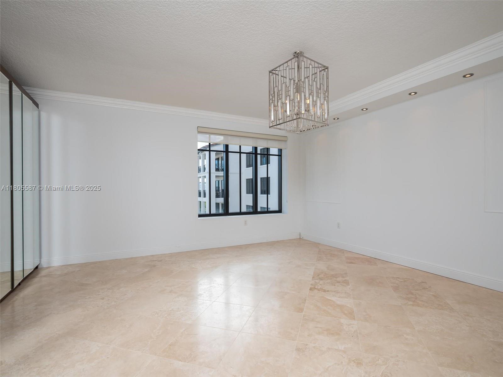 200 East Palmetto Park Road, Unit 700 Boca Raton, FL 33432 - Photo 15 of 36 a view of an empty room with chandelier