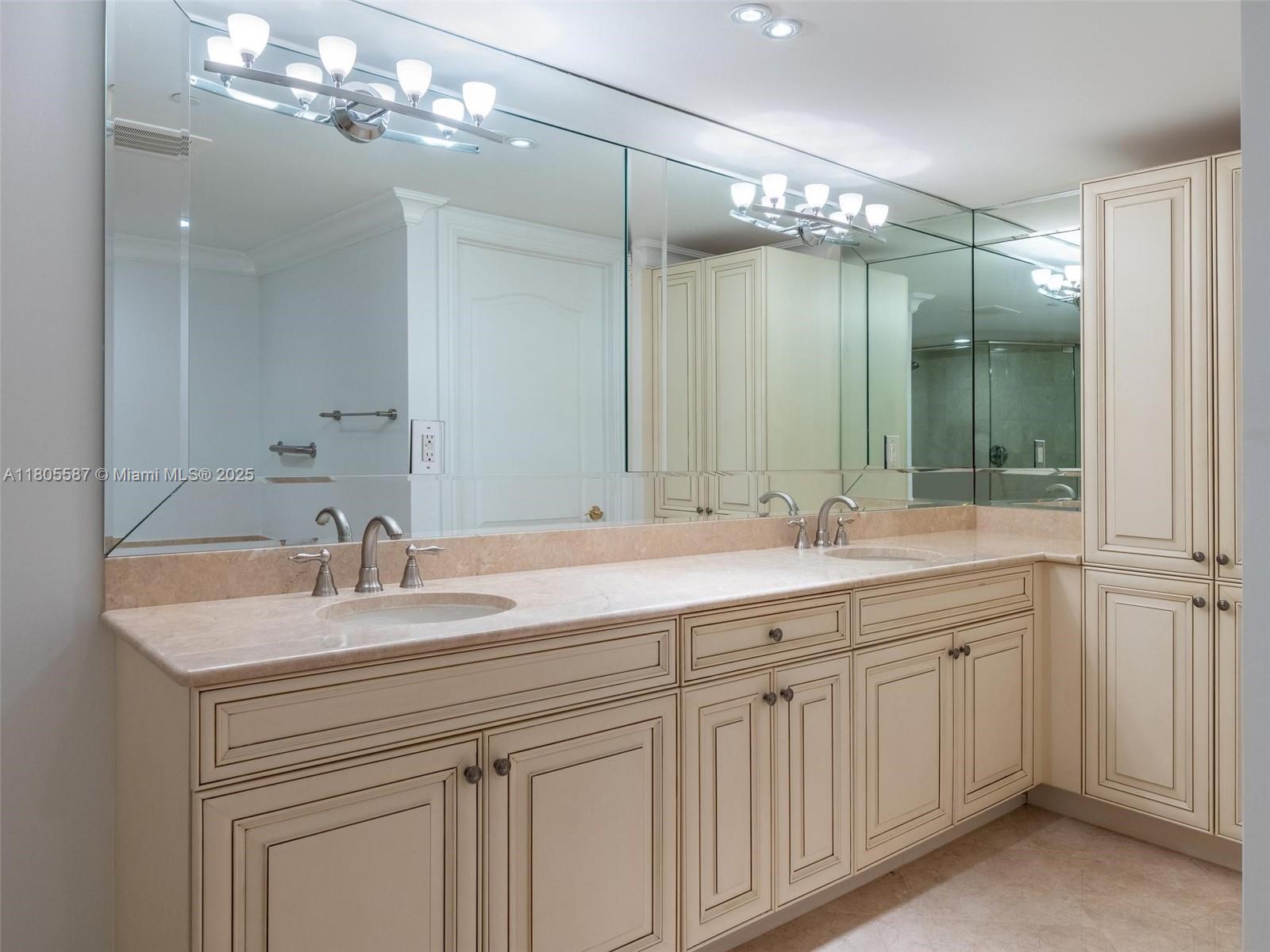 200 East Palmetto Park Road, Unit 700 Boca Raton, FL 33432 - Photo 17 of 36 a bathroom with a sink double vanity and a mirror