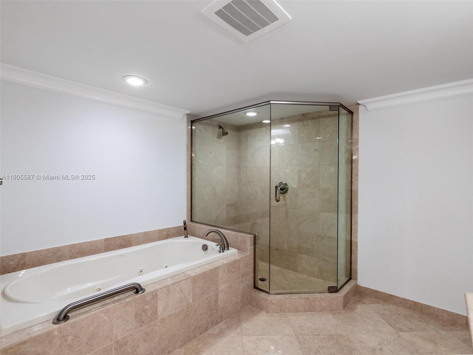 200 East Palmetto Park Road, Unit 700 Boca Raton, FL 33432 - Photo 18 of 36 a bathroom with a tub and shower