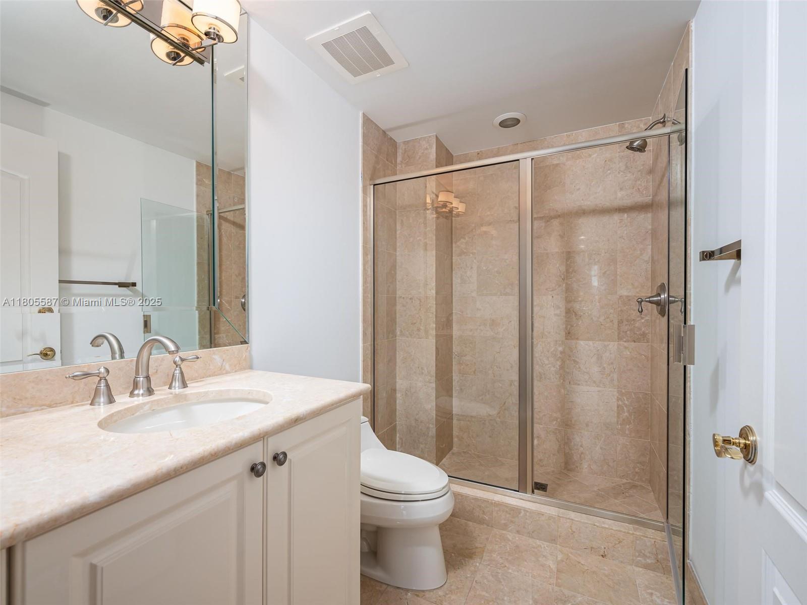 200 East Palmetto Park Road, Unit 700 Boca Raton, FL 33432 - Photo 23 of 36 a bathroom with a sink a toilet and shower