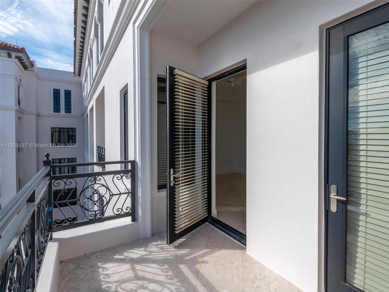 200 East Palmetto Park Road, Unit 700 Boca Raton, FL 33432 - Photo 32 of 36 a view of a porch with wooden floor and a door