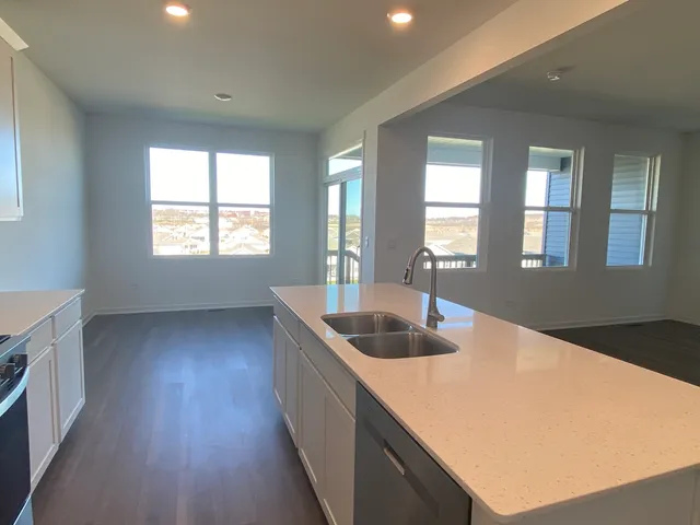 a kitchen with sink and window