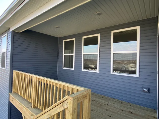a view of outdoor space and deck of the house