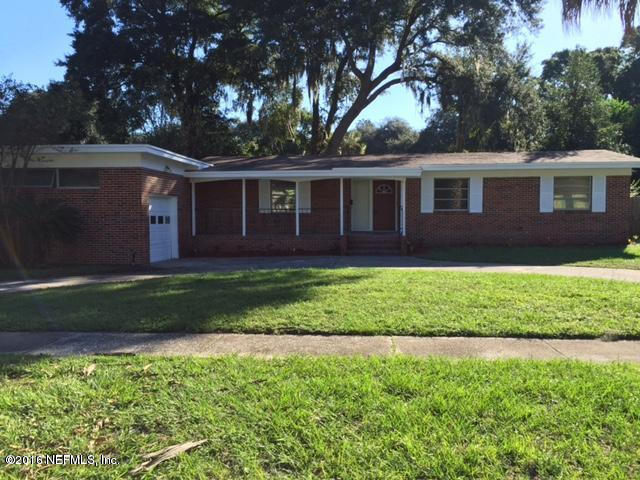 3853 Bess Road Jacksonville, FL 32277 - Photo 1 of 22 a front view of a house with a garden