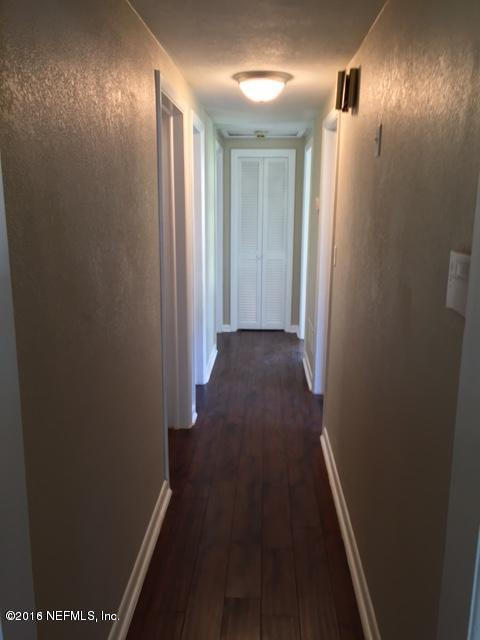 3853 Bess Road Jacksonville, FL 32277 - Photo 11 of 22 a view of gallery with wooden floor