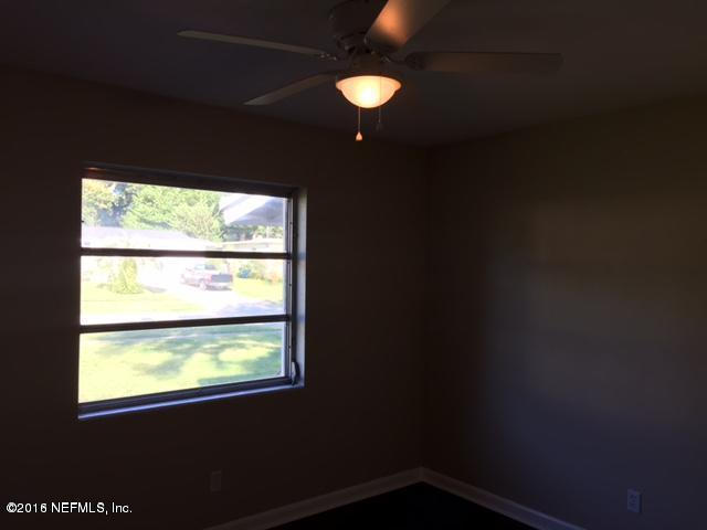 3853 Bess Road Jacksonville, FL 32277 - Photo 12 of 22 a view of an empty room with a window
