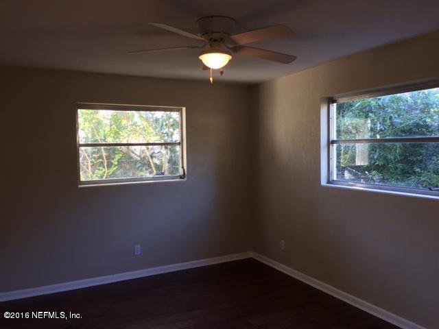 3853 Bess Road Jacksonville, FL 32277 - Photo 14 of 22 an empty room with a window