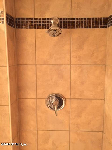 3853 Bess Road Jacksonville, FL 32277 - Photo 16 of 22 a bathroom with a shower