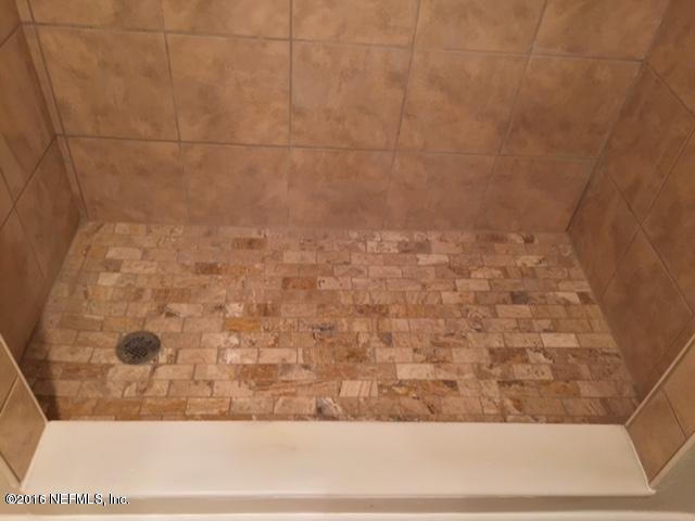 3853 Bess Road Jacksonville, FL 32277 - Photo 17 of 22 a bathroom with a shower