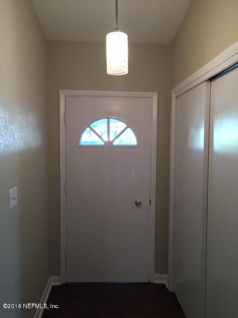 3853 Bess Road Jacksonville, FL 32277 - Photo 2 of 22 an empty room with a window