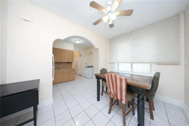 a kitchen with a stove top oven and cabinets