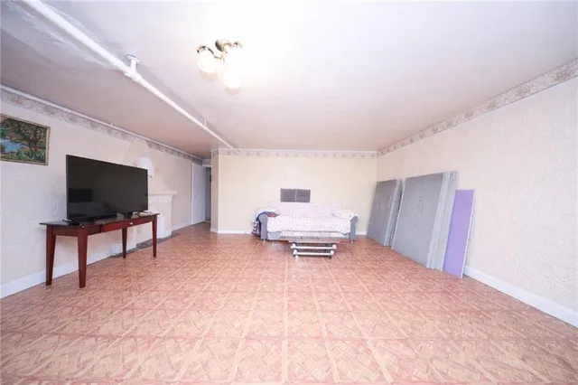 a kitchen with a sink cabinets and a window