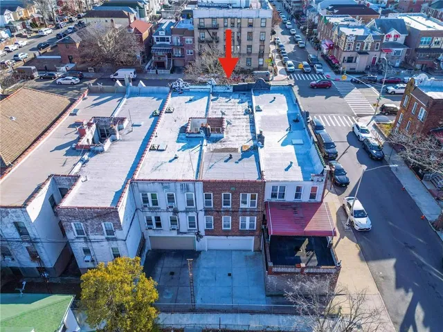 an aerial view of a house with a ocean view