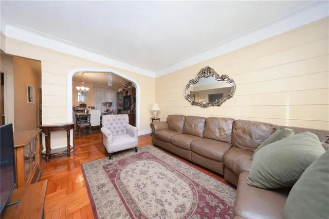 a living room with furniture and a rug
