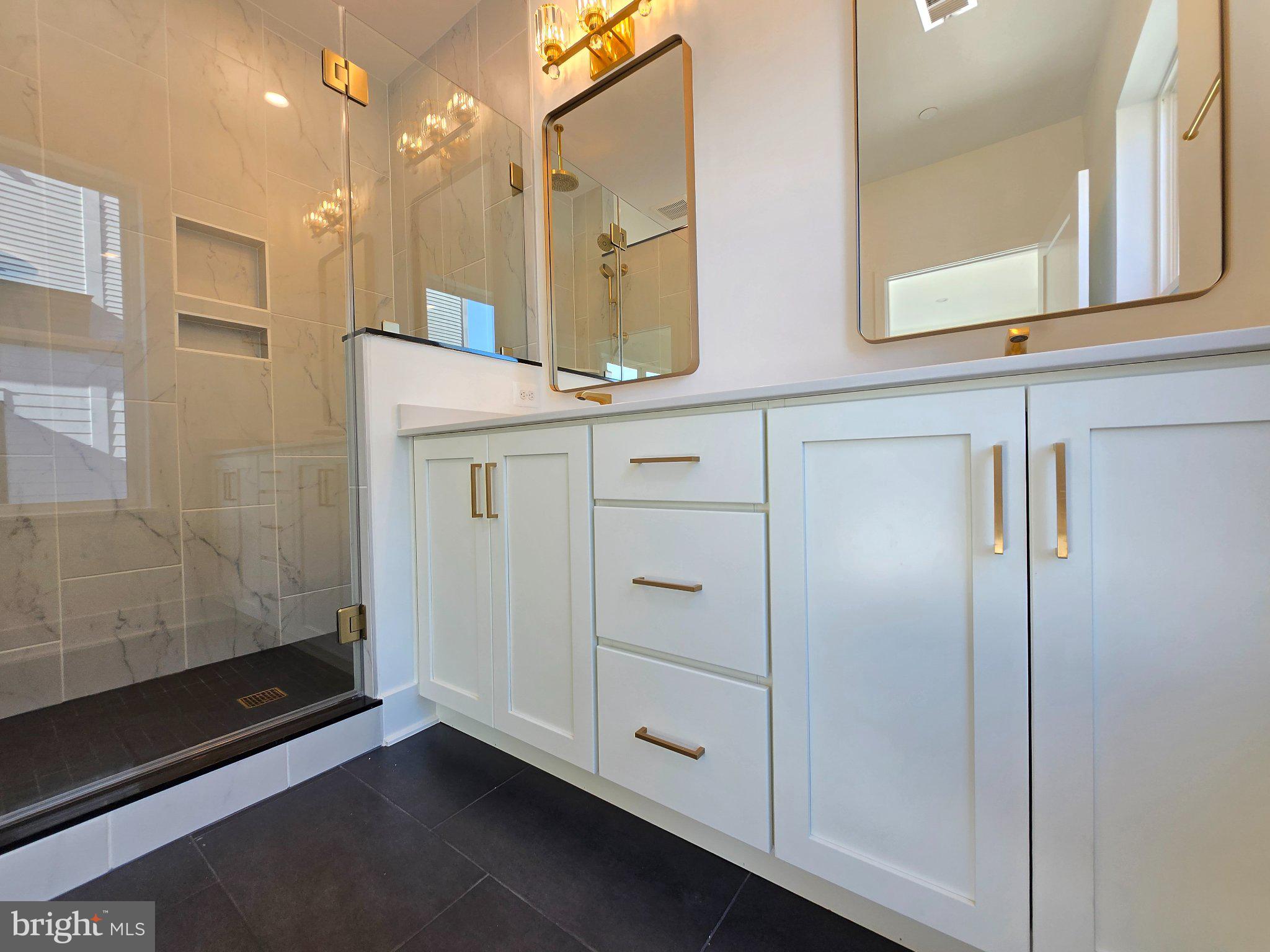 2106 Tysons Ridgeline Road Falls Church, VA 22043 - Photo 12 of 28 Sleek modern bathroom with elegant finishes.