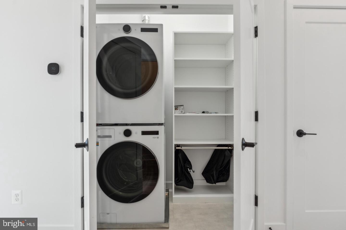 2106 Tysons Ridgeline Road Falls Church, VA 22043 - Photo 14 of 28 Sleek laundry nook with modern appliances.
